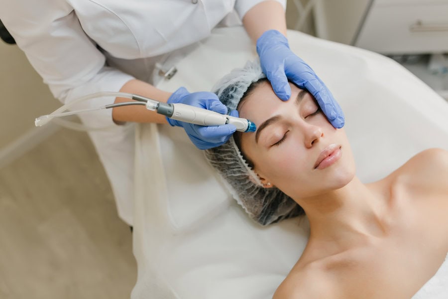 A woman in the middle of a cosmetic procedure.